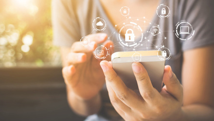 Using smartphone with icon graphic cyber security network of connected devices and personal data iStock-1090870004.jpg 3